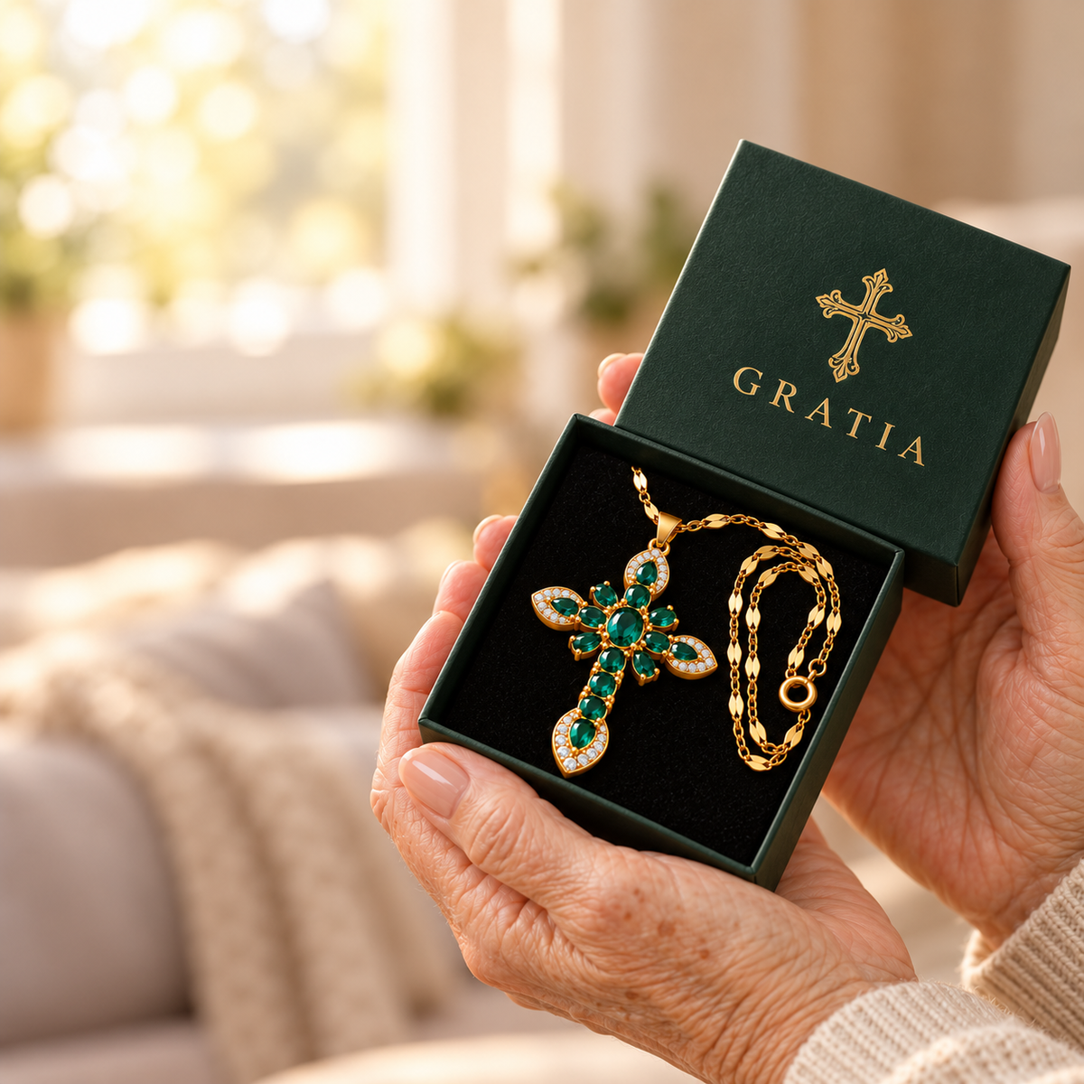 Grandmother holding a Gratia cross necklace in its gift box